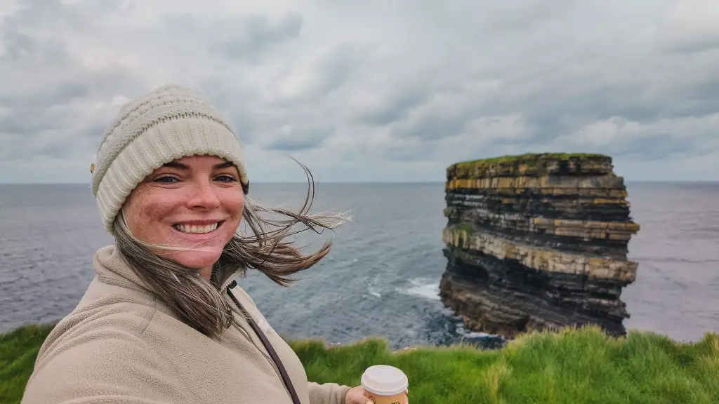 Katie in front of Downpatrick Head in Ireland.
